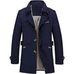 Dark navy double-breasted trench-style coat with wide lapels, shoulder epaulets, buttoned cuffs, a zip chest pocket, and a light check-pattern lining visible inside.