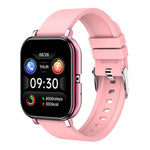 Pink, rectangular smartwatch with a light gray silicone strap, displaying the time “09:30,” date “03/06 MON,” and a colorful fitness dashboard with labeled bars for BPM, KM, KCAL, and STEP.