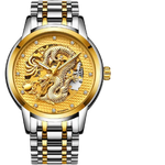 Two-tone silver-and-gold metal wristwatch with a gold dial featuring an embossed dragon design, crystal hour markers, and a partially open “skeleton” window showing the movement.