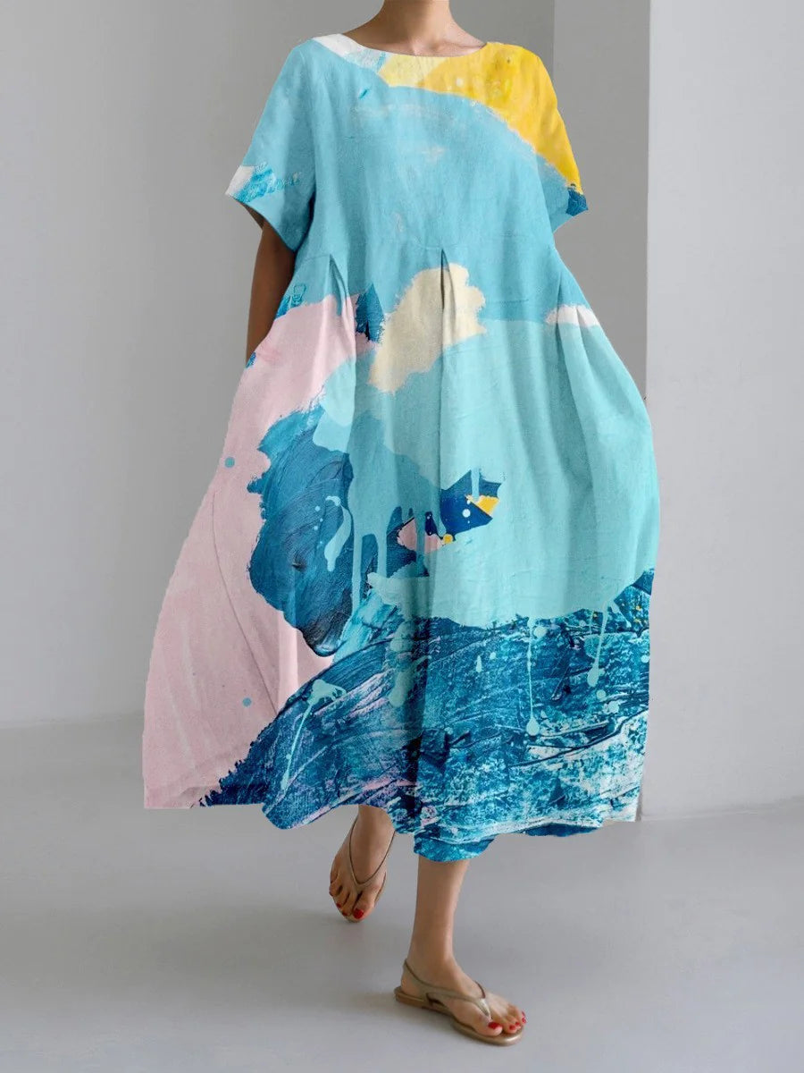 Woman wearing a loose-fitting, white midi dress with short sleeves, featuring bold red-orange floral prints accented with blue centers, paired with flat sandals.