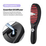 Ad graphic for a black scalp massage brush with red silicone bristles and a built-in essential oil diffuser emitting mist; text reads “15ml capacity” and “Essential Oil Diffuser” with a close-up inset of oil being dropped into the reservoir.