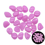 Scattered set of small smooth translucent purple pebbles on a white background, with a circular inset showing the pebbles glowing in the dark.