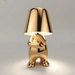Gold animal-shaped table lamp with glossy finish and matching lampshade.
