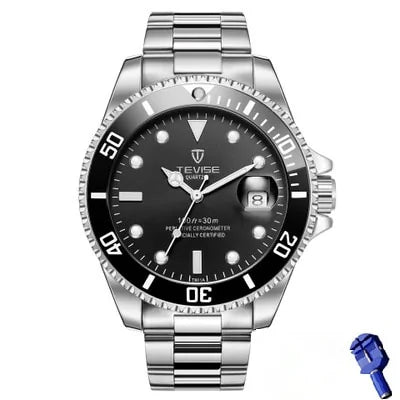 Silver stainless-steel dive-style wristwatch with a black rotating bezel and black dial, luminous markers and hands, and a date window at 3 o’clock with a magnifying lens; a small blue adjustment tool is shown beside it on a white background.
