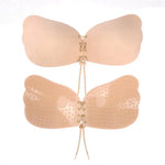 Beige adhesive strapless bra with lace-up front, shown front and inside.