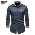 Black long-sleeve button-up shirt with check trim.
