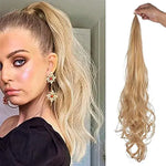 Side-by-side image showing a woman wearing a blonde wavy ponytail extension (left) and the matching long blonde curly ponytail hairpiece being held up by a hand on a white background (right).