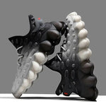 Black and white bubble sole athletic trainers.