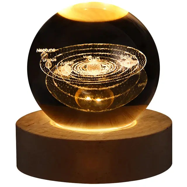 Clear glass orb night light on a wooden base, featuring an illuminated cloud with small glowing raindrops inside, set against a dark background.