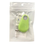 Green keychain-style tracking tag inside a clear resealable plastic pouch, with a small instruction card visible behind it on a white background.