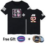 Black graphic T-shirt with free gift accessories.

