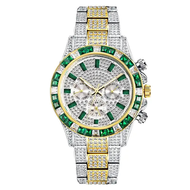 A luxurious, diamond-encrusted watch with a silver and gold bracelet. The watch features large green gemstones around the dial and intricate detailing, creating a flashy and opulent look.