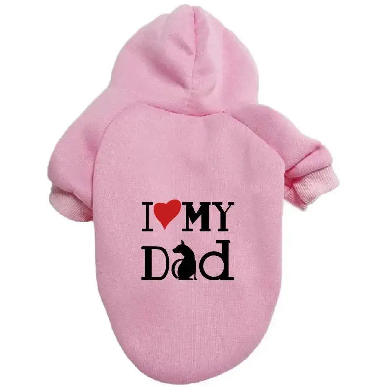 A pet hoodie with a hood and short sleeves, featuring the text 'I ❤️ MY DAD' printed on the back. The word 'Dad' includes a silhouette of a sitting dog integrated into the letter 'D'.