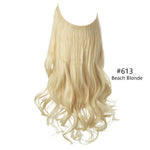 Long wavy halo hair extension with a U-shaped top weft, medium brown roots fading into ash-beige blonde highlights, on a white background.