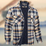A dark brown men's pullover sweater with a textured cable knit pattern on the front. The sweater features a high ribbed collar with tan brown buttoned detailing, ribbed cuffs and hem, and matching tan elbow patches. The background consists of distressed, multicolored metal panels.