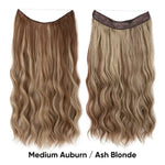 A studio product image of two long, wavy flip-in/halo hair extensions on a white background, shown in different shades—medium auburn and ash blonde—with a thin wire/halo band along the top. Text at the bottom reads “Medium Auburn / Ash Blonde.”