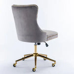Gray velvet office chair with gold base on a white background