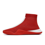 A red sock-style high-top sneaker with a breathable knit upper, streamlined slip-on shape, and a low-profile sole. It features white contrast detailing along the side and heel, with a sporty minimalist look.
