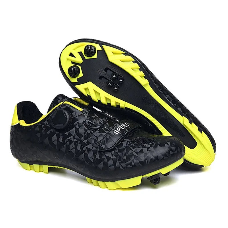 A pair of vibrant cycling shoes with a black and neon yellow camouflage pattern. The shoes feature a rugged sole with cleats, suitable for mountain biking or off-road cycling. They have two Velcro straps and a buckle fastening system for a secure fit. One shoe is placed upright while the other rests on its side, displaying the cleated sole.